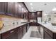 Spacious kitchen with granite countertops and custom cabinetry at 6007 Burrowing Owl Pl, Lithia, FL 33547