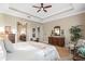 Main bedroom with ensuite bathroom and walk-in closet, offering a tranquil retreat at 6007 Burrowing Owl Pl, Lithia, FL 33547