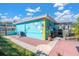 Unique teal home exterior with fun and quirky decor at 6500 7Th S Way, St Petersburg, FL 33705