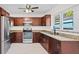 Bright kitchen boasts stainless steel appliances and granite countertops at 6500 7Th S Way, St Petersburg, FL 33705