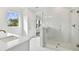 Bright bathroom with walk-in shower, and a window at 709 W Orient St, Tampa, FL 33603