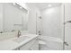 Bathroom with a bathtub, sink, and marble shower at 709 W Orient St, Tampa, FL 33603