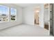 Well-lit bedroom with two windows and en-suite bathroom at 709 W Orient St, Tampa, FL 33603