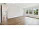 Light-filled bedroom featuring hardwood floors and a private bathroom at 709 W Orient St, Tampa, FL 33603