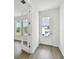 Bright entryway with hardwood floors and a mirrored glass door at 709 W Orient St, Tampa, FL 33603