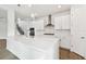 Modern kitchen with white cabinets and large island at 709 W Orient St, Tampa, FL 33603