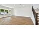 Open living room with hardwood floors and staircase at 709 W Orient St, Tampa, FL 33603