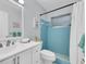 Clean bathroom with white vanity and light blue tile shower at 4444 Swift Rd # 20, Sarasota, FL 34231