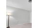 Simple bedroom with neutral walls, carpeting, and floor lamp at 4444 Swift Rd # 20, Sarasota, FL 34231