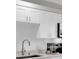 Stylish kitchen with white shaker cabinets and sleek hardware at 4444 Swift Rd # 20, Sarasota, FL 34231