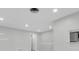 Open living area with recessed lighting, new paint, and tiled floor at 4444 Swift Rd # 20, Sarasota, FL 34231