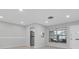 Bright and airy living room with a view to the kitchen and screened porch at 4444 Swift Rd # 20, Sarasota, FL 34231