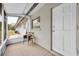 Cozy screened porch with seating and neutral decor at 4444 Swift Rd # 20, Sarasota, FL 34231