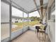 Relaxing screened porch with seating area, overlooking a grassy backyard at 4444 Swift Rd # 20, Sarasota, FL 34231