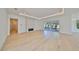 Spacious living room featuring recessed lighting, a modern fireplace, and sliding glass doors at 4608 S Ferdinand Ave, Tampa, FL 33611