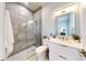 Elegant bathroom with gray tile, floating vanity, and glass shower at 10101 Eagle Preserve Dr, Englewood, FL 34224