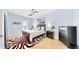 Bright bedroom with a zebra rug and plenty of natural light at 10101 Eagle Preserve Dr, Englewood, FL 34224