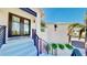 Modern home exterior with stylish staircase and double doors at 10101 Eagle Preserve Dr, Englewood, FL 34224