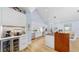 Modern kitchen with stainless steel appliances and white cabinetry at 10101 Eagle Preserve Dr, Englewood, FL 34224
