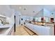 Open concept kitchen with long island and stainless steel appliances at 10101 Eagle Preserve Dr, Englewood, FL 34224