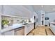Sleek kitchen featuring a farmhouse sink and quartz countertops at 10101 Eagle Preserve Dr, Englewood, FL 34224