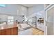 Bright kitchen, featuring white cabinets and a double oven at 10101 Eagle Preserve Dr, Englewood, FL 34224