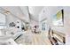 Modern living room with open floor plan and fireplace at 10101 Eagle Preserve Dr, Englewood, FL 34224