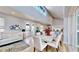 Open concept living and dining area with hardwood floors at 10101 Eagle Preserve Dr, Englewood, FL 34224