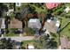 Aerial view of a single-Gathering home with a large backyard and pool at 1466 Laconia W Dr, Clearwater, FL 33764