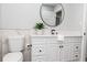 Bathroom with white vanity and marble-look tile at 1466 Laconia W Dr, Clearwater, FL 33764