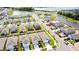 Aerial view of a community with houses, a lake, and a pool at 12113 Water Ash Pl, Riverview, FL 33569