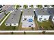 Aerial view of three homes with fenced backyards at 12113 Water Ash Pl, Riverview, FL 33569