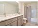 Modern bathroom with double vanity and shower at 12113 Water Ash Pl, Riverview, FL 33569