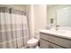 Bathroom with a shower/tub combo and grey vanity at 12113 Water Ash Pl, Riverview, FL 33569