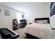 Spacious bedroom with a comfortable bed and workspace at 12113 Water Ash Pl, Riverview, FL 33569