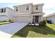 Two-story house with attached garage and landscaped front yard at 12113 Water Ash Pl, Riverview, FL 33569