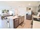 Open concept kitchen with island and stainless steel appliances at 12113 Water Ash Pl, Riverview, FL 33569