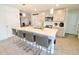 Modern kitchen with island, stainless steel appliances, and grey cabinets at 12113 Water Ash Pl, Riverview, FL 33569