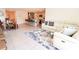 Open living room with large sectional sofa and rug at 12113 Water Ash Pl, Riverview, FL 33569