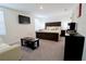 Bright main bedroom with king-size bed and sitting area at 12113 Water Ash Pl, Riverview, FL 33569