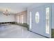 Bright entryway with a white door and decorative glass at 4147 Marine Pkwy, New Port Richey, FL 34652