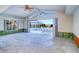 Open living room with view of sunroom and pool area at 4147 Marine Pkwy, New Port Richey, FL 34652