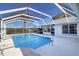 Inviting screened pool with ample deck space for relaxation at 4147 Marine Pkwy, New Port Richey, FL 34652