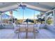 Relaxing sunroom with outdoor seating and scenic water views at 4147 Marine Pkwy, New Port Richey, FL 34652