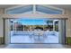 Spacious sunroom with water views, accessible from the main living area at 4147 Marine Pkwy, New Port Richey, FL 34652
