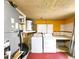 Laundry room with washer, dryer, and cabinets at 7521 Coventry Dr, Port Richey, FL 34668