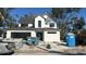 Two-story modern farmhouse under construction with gray roof and white exterior at 307 W West St, Tampa, FL 33602