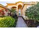 Inviting front entry with a brick walkway and lush landscaping at 4961 Sapphire Sound Dr, Wimauma, FL 33598