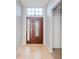 Interior entryway with tiled floor and a stained-glass door at 5627 War Admiral Dr, Wesley Chapel, FL 33544