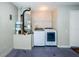 Laundry room with washer, dryer, and extra shelving at 5627 War Admiral Dr, Wesley Chapel, FL 33544